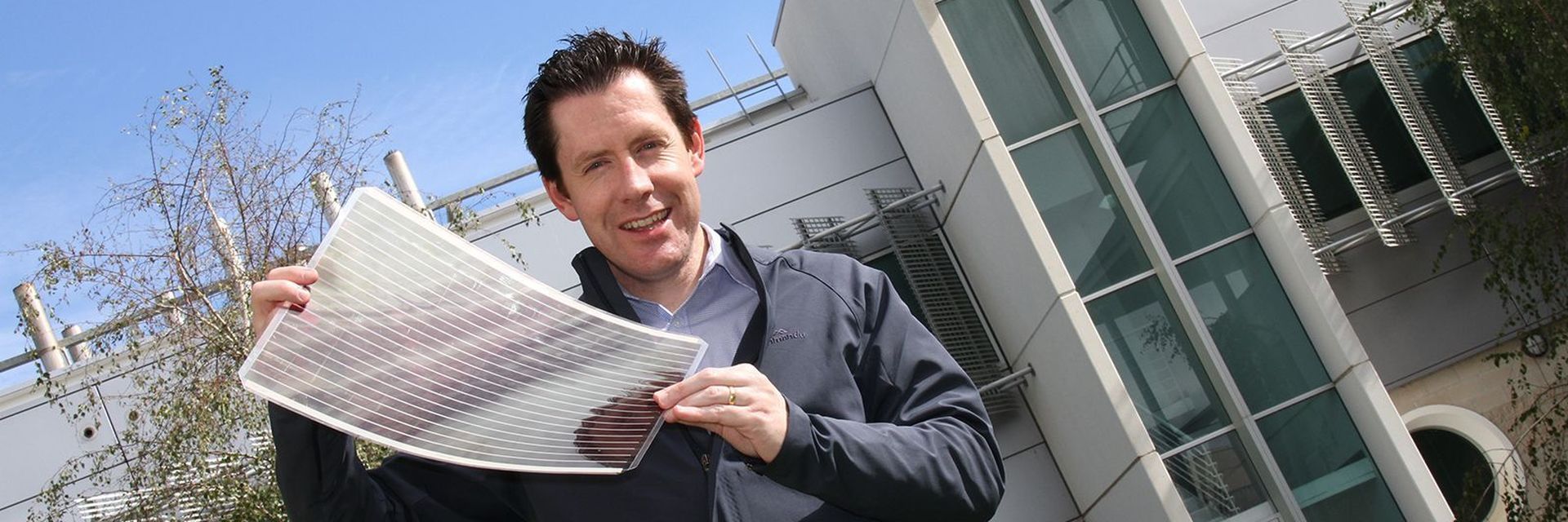 CSIRO ScienceImage Dr Scott Watkins holding a sheet of flexible solar cells